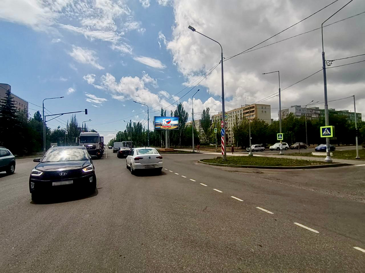 Фотография рекламного носителя, тип: Билборд 3x6, адрес: Строителей пр-т. Х Шевченко б-р., Мариуполь, Донецкая область, Россия. Сторона A1-А10 №1097601