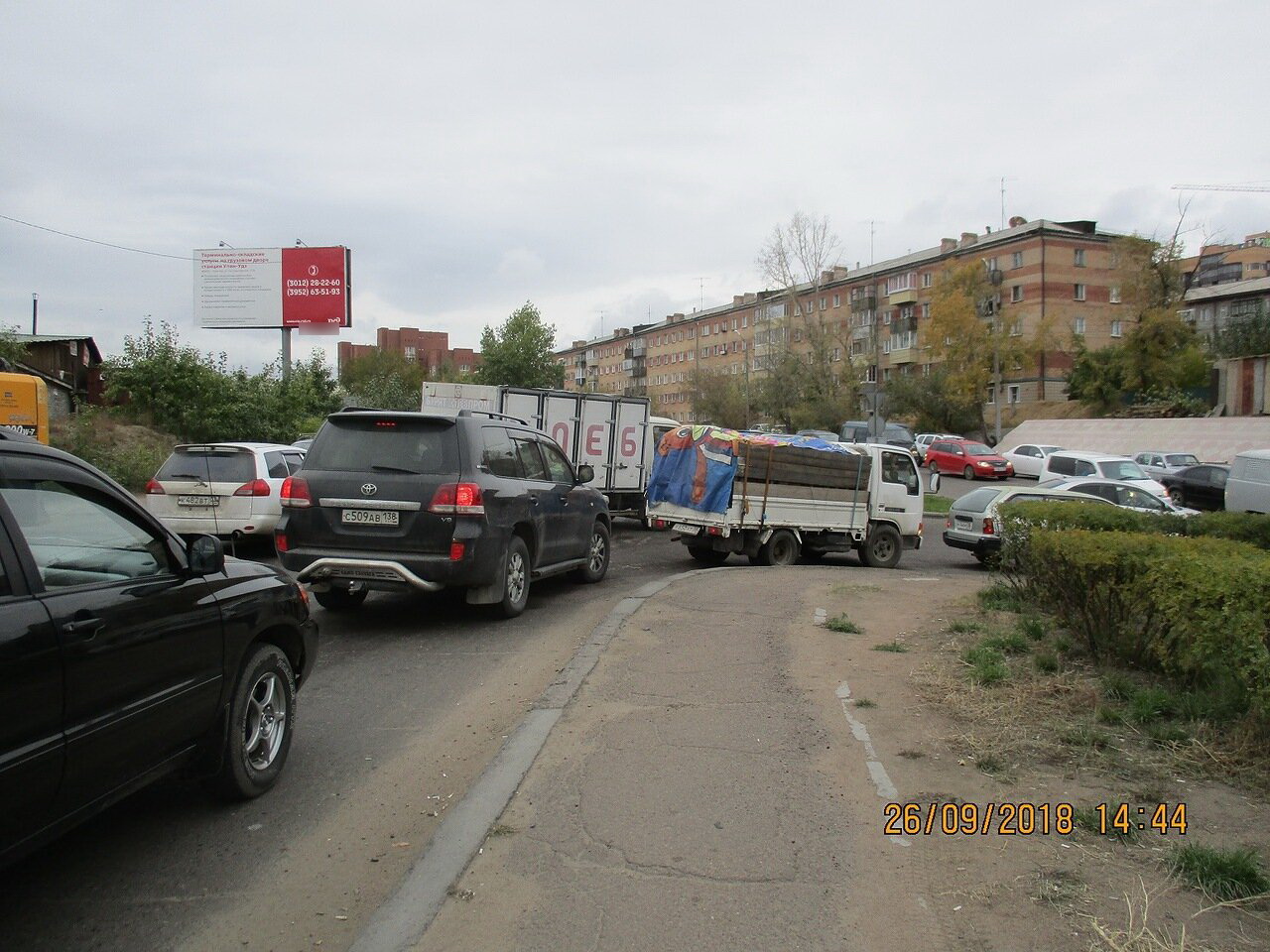 Фотография рекламного носителя, тип: Билборд 3x6, адрес: Революции 1905 года ул., гараж, Улан-Удэ, Республика Бурятия, Россия. Сторона В №697297