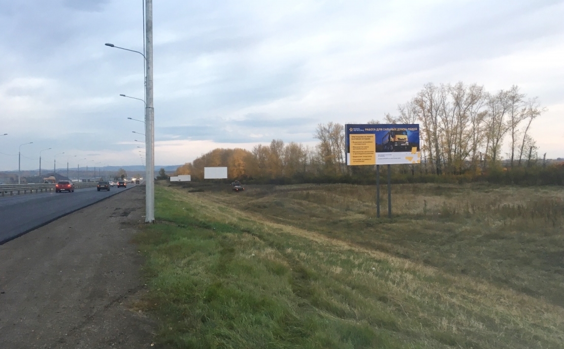 Фотография рекламного носителя, тип: Билборд 3x6, адрес: Трасса М-53, 801 845м, Красноярск, Красноярский край, Россия. Сторона А №799777
