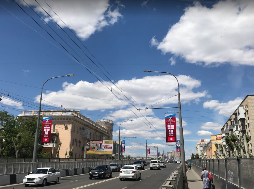 Фотография рекламного носителя, тип: Панель-кронштейн, адрес: Комсомольская ул., ж/д мост, Волгоград, Волгоградская область, Россия. Сторона A №1096123