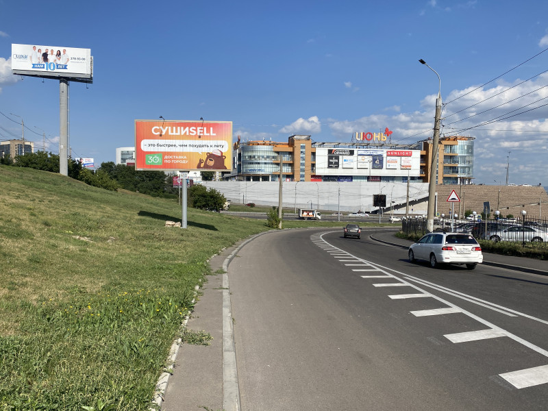 Фотография рекламного носителя, тип: Билборд 3x6, адрес: Партизана Железняка ул., съезд на Октябрьский мост, Красноярск, Красноярский край, Россия. Сторона A1-A3 №1024257