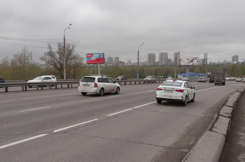 Фотография рекламного носителя, тип: Билборд 3x6, адрес: Октябрьский мост, остров Татышев, 244м до мостового сооружения, Красноярск, Красноярский край, Россия. Сторона В №534674