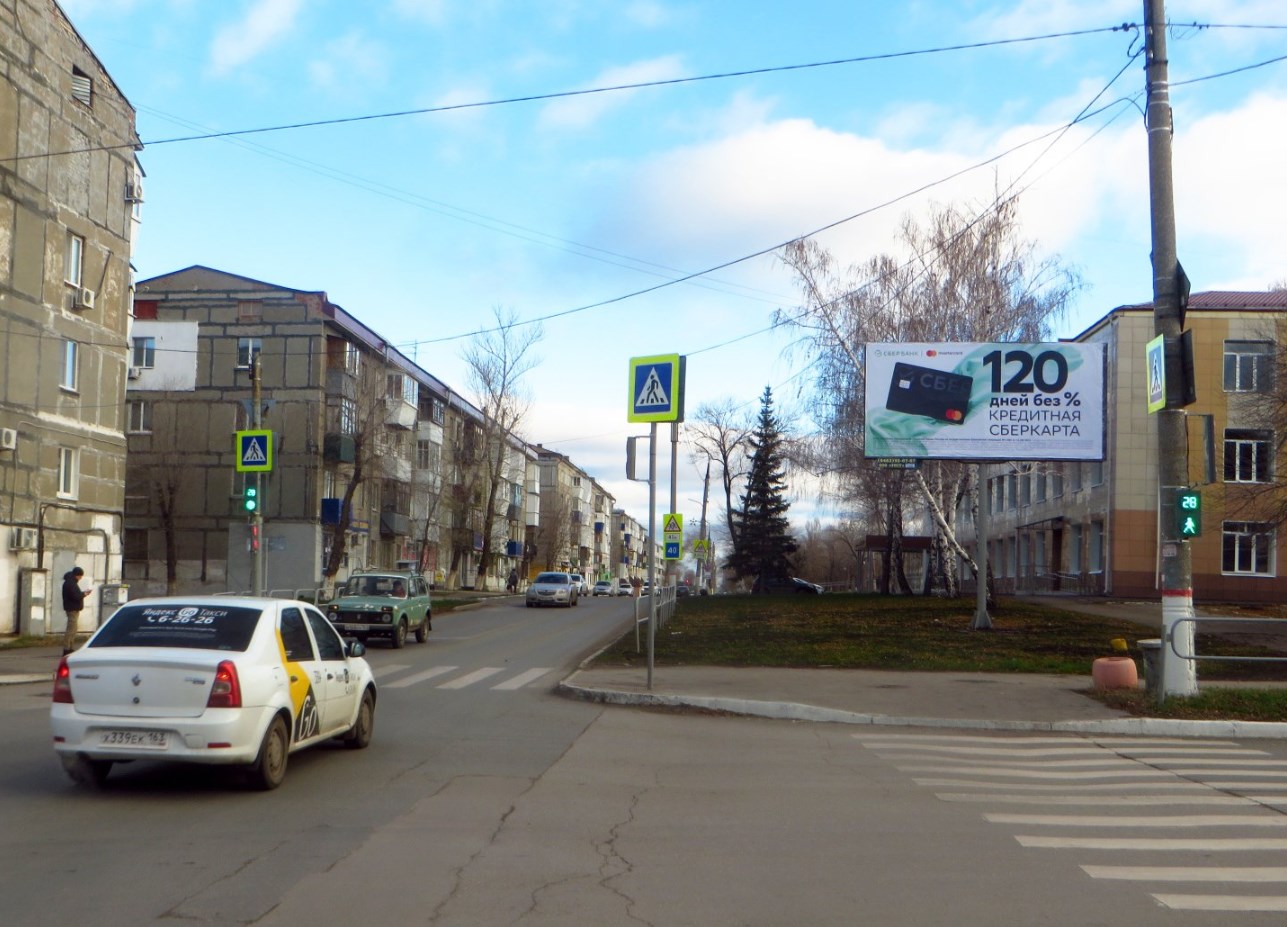 Фотография рекламного носителя, тип: Билборд 3x6, адрес: Чернышевского ул., д.24 Х Островского ул., Новокуйбышевск, Самарская область, Россия. Сторона А №661832