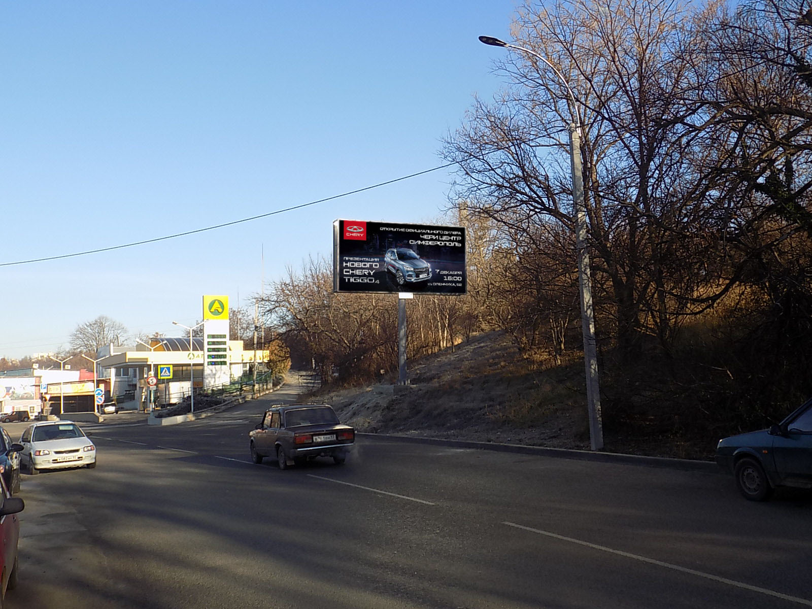 Фотография рекламного носителя, тип: Билборд 3x6, адрес: Объездная ул., АЗС Атан, Симферополь, Республика Крым, Россия. Сторона A №797301
