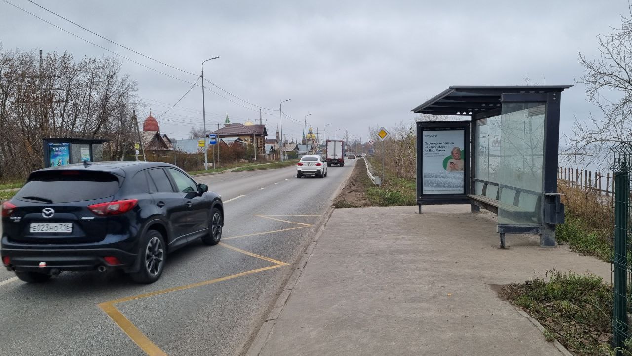 Фотография рекламного носителя, тип: Остановка 1.8x1.2, адрес: 2-я Старо-Аракчинская ул., д.10Д, Казань, Республика Татарстан, Россия. Сторона A №993469