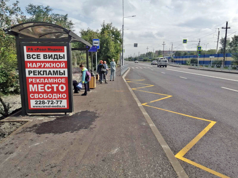 Фотография рекламного носителя, тип: Остановка 1.8x1.2, адрес: Семафорная ул., д.201, Красноярск, Красноярский край, Россия. Сторона Б №1098270