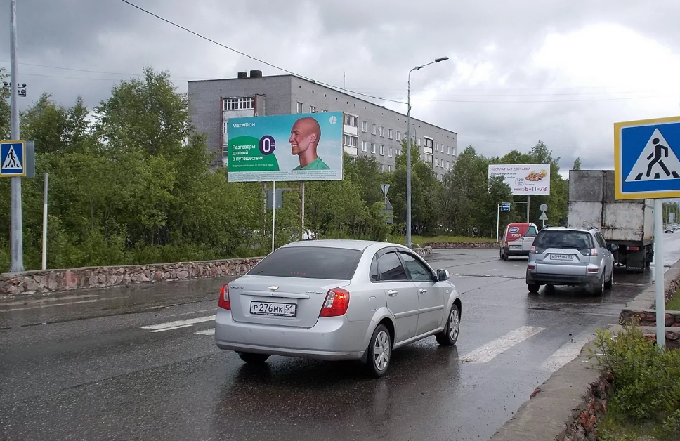 Фотография рекламного носителя, тип: Билборд 3x6, адрес: Строительная ул., д.53, поз.1, Оленегорск, Мурманская область, Россия. Сторона B №1325983