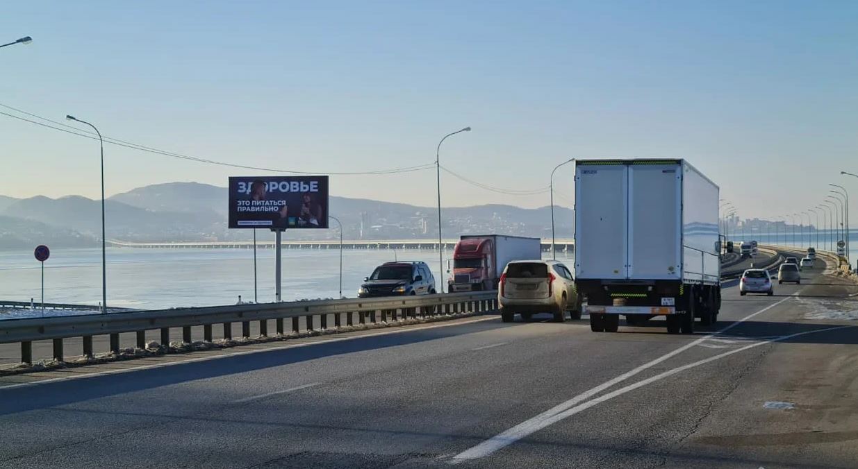 Фотография рекламного носителя, тип: Билборд 3x6, адрес: Де-Фриз п-ов.-Новый пос., а/д., 28 800м, въезд на Низководный мост, Владивосток, Приморский край, Россия. Сторона Б №871881
