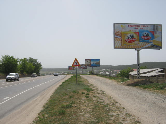 Фотография рекламного носителя, тип: Билборд 3x6, адрес: Ялтинская Объездная ул., перед Авторынком, Симферополь, Республика Крым, Россия. Сторона A №412183