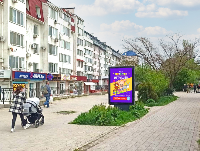 Фотография рекламного носителя, тип: Ситиформат 1.8x1.2, адрес: Старшинова б-р., д.8Д, Феодосия, Республика Крым, Россия. Сторона В №1081147