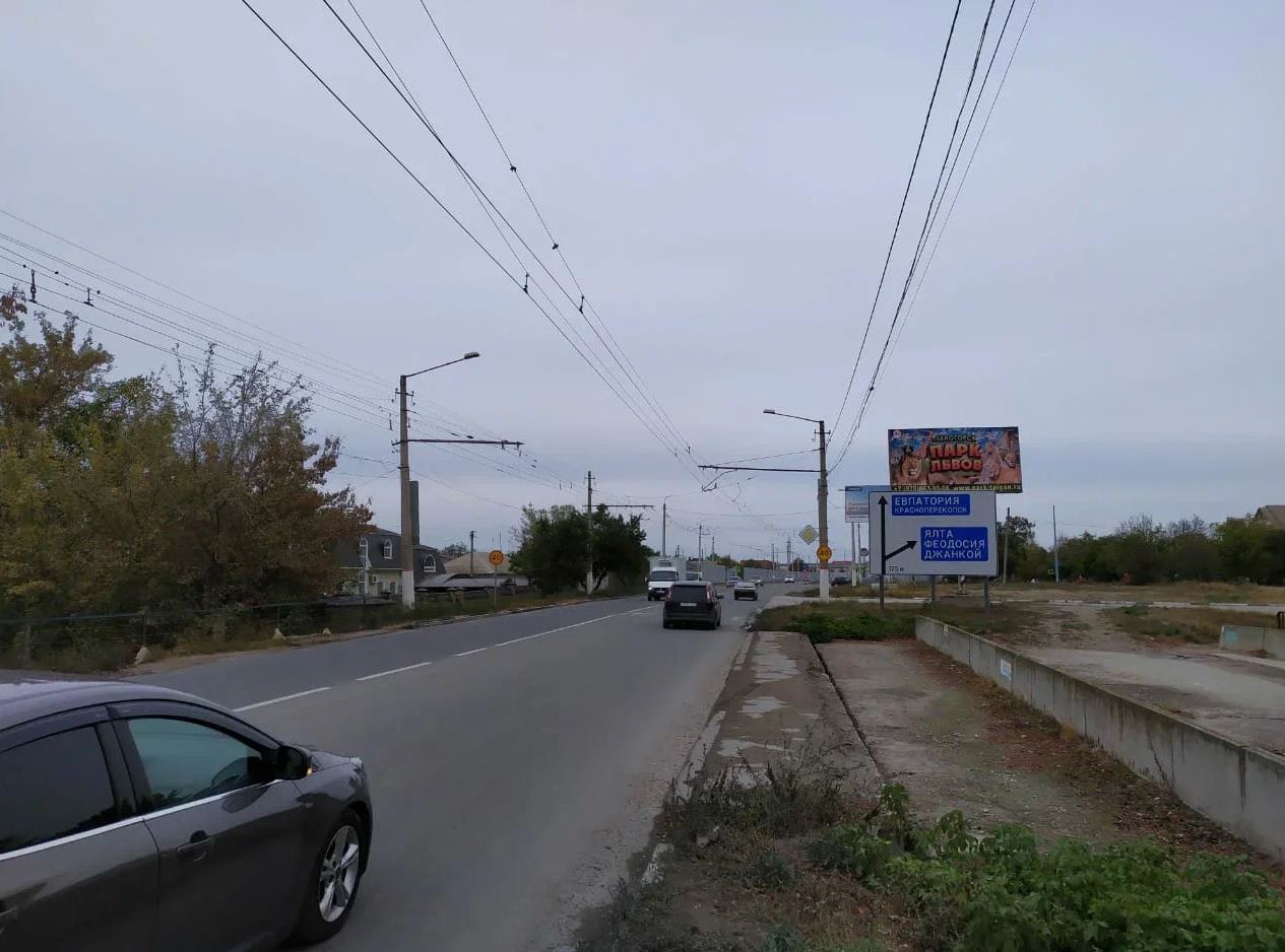 Фотография рекламного носителя, тип: Билборд 3x6, адрес: Евпаторийское ш., д.175, Симферополь, Республика Крым, Россия. Сторона А №799515