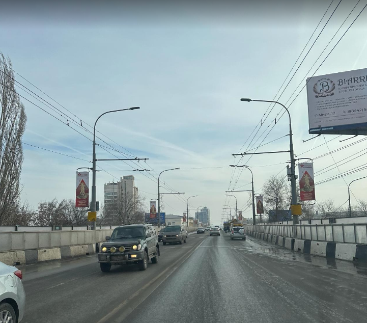 Фотография рекламного носителя, тип: Панель-кронштейн, адрес: Комсомольская ул., ж/д мост, Волгоград, Волгоградская область, Россия. Сторона Б №1096124