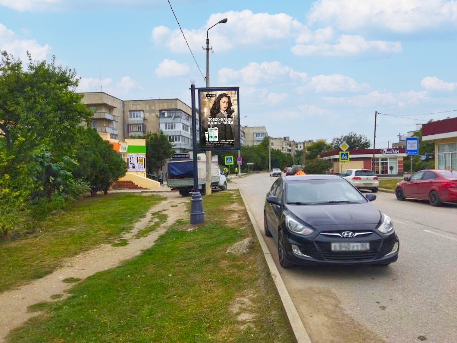 Фотография рекламного носителя, тип: Ситиформат 1.8x1.2, адрес: Старшинова б-р., д.19, поз.2, Феодосия, Республика Крым, Россия. Сторона B №958413