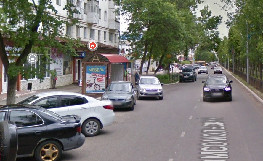 Фотография рекламного носителя, тип: Остановка 1.8x1.2, адрес: Комсомольский пр-т., д.24, Нефтекамск, Республика Башкортостан, Россия. Сторона B1 №1054292