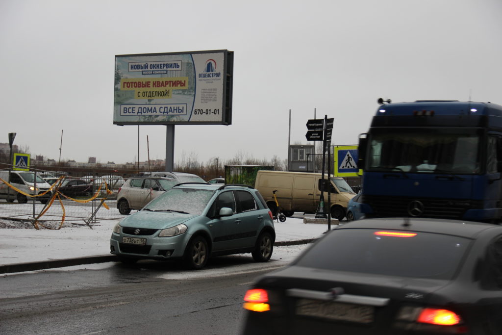 Фотография рекламного носителя, тип: Билборд 3x6, адрес: Строителей пр. Х Областная ул., Кудрово, Ленинградская область, Россия. Сторона B №1021387