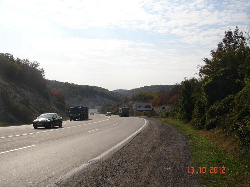 Фотография рекламного носителя, тип: Билборд 3x6, адрес: Краснодар-Новороссийск а/д А-146, поворот на ст. Раевская, Новороссийск, Краснодарский край, Россия. Сторона А №1021109