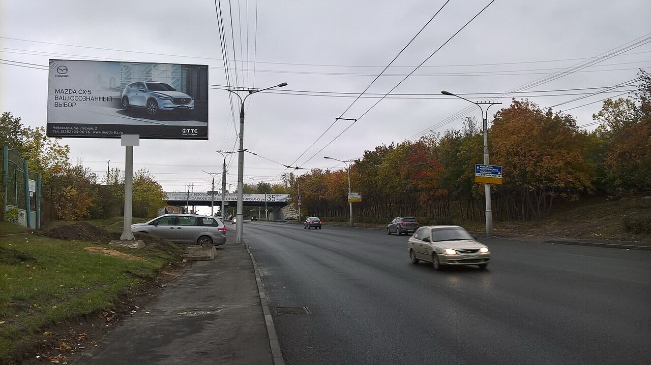 Фотография рекламного носителя, тип: Билборд 3x6, адрес: Фучика ул., Гагаринский мост N 40, Чебоксары, Республика Чувашия, Россия. Сторона B №825161