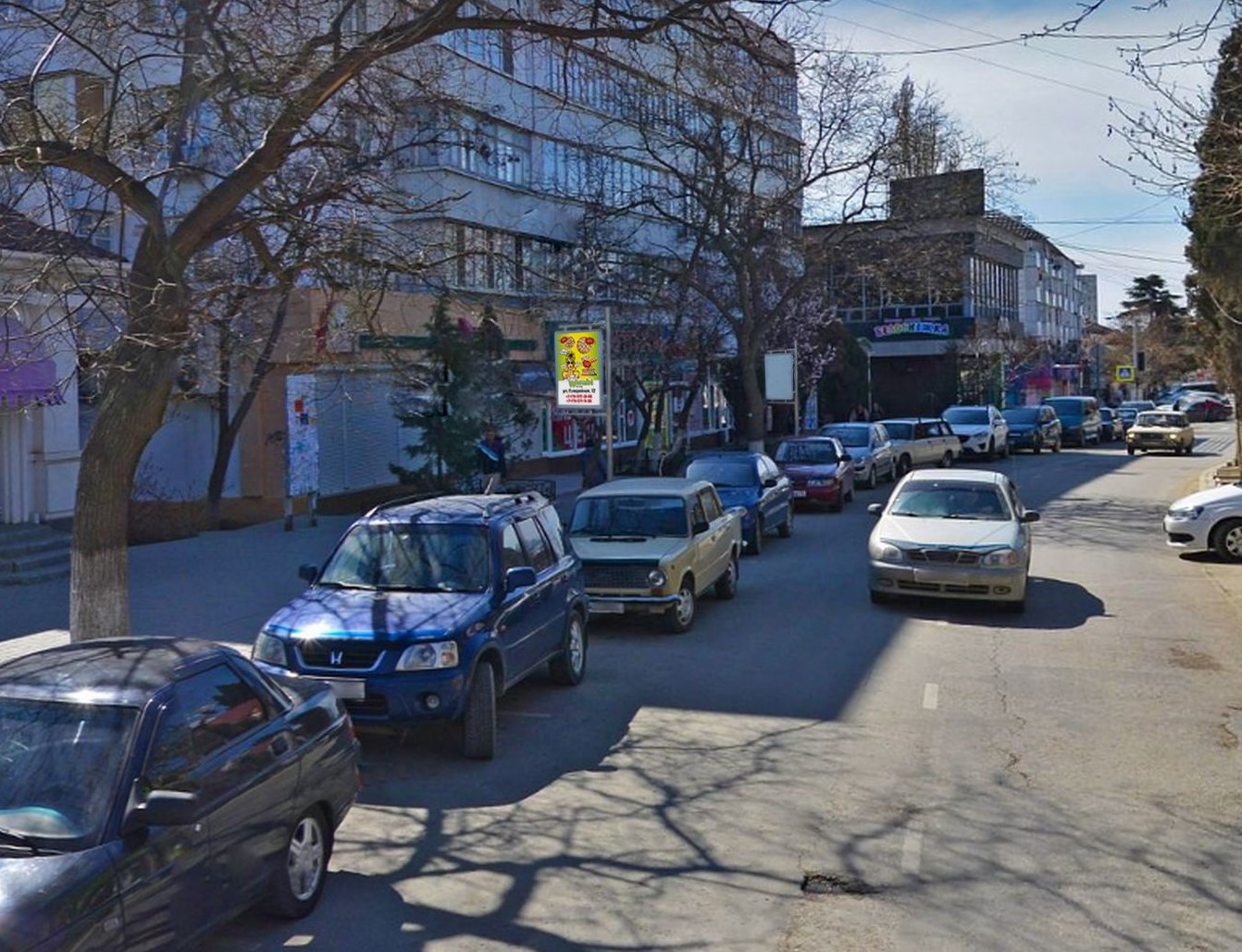 Фотография рекламного носителя, тип: Ситиформат 1.8x1.2, адрес: Ленина ул., д.57, поз.1, Судак, Республика Крым, Россия. Сторона B №1046983