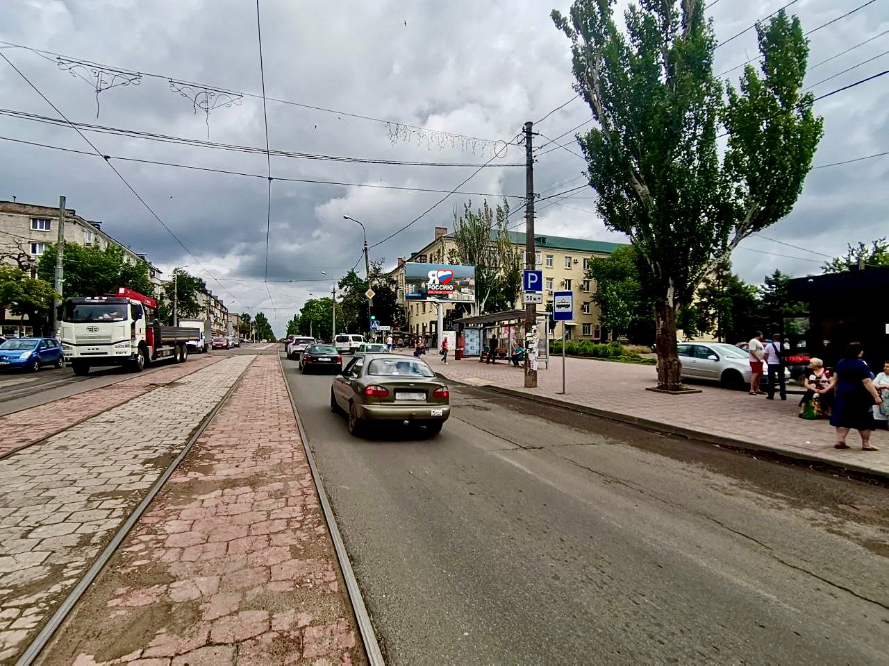 Фотография рекламного носителя, тип: Билборд 3x6, адрес: Металлургов пр-т. Х Блажевича ул., поз.1, Мариуполь, Донецкая область, Россия. Сторона A1-А10 №1097591