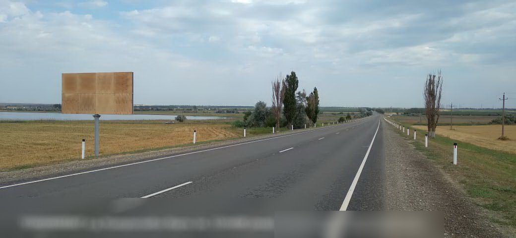 Фотография рекламного носителя, тип: Билборд 3x6, адрес: Новороссийск-Керчь а/д, 110 600м, Темрюк, Краснодарский край, Россия. Сторона B №840660