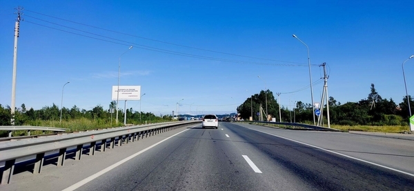 Фотография рекламного носителя, тип: Билборд 3x6, адрес: подъезд к аэропорту г. Вл-ка а/д , 20м, Владивосток, Приморский край, Россия. Сторона Б №937826