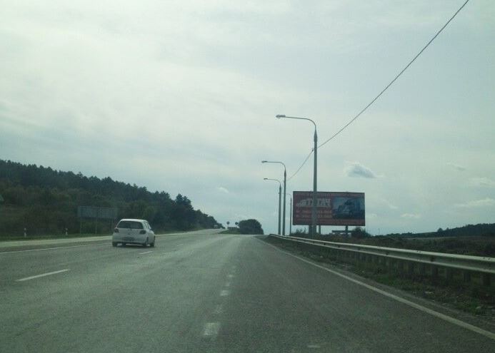 Фотография рекламного носителя, тип: Билборд 3x6, адрес: А-146 а/д., 139 850м, Новороссийск, Краснодарский край, Россия. Сторона A №1005752