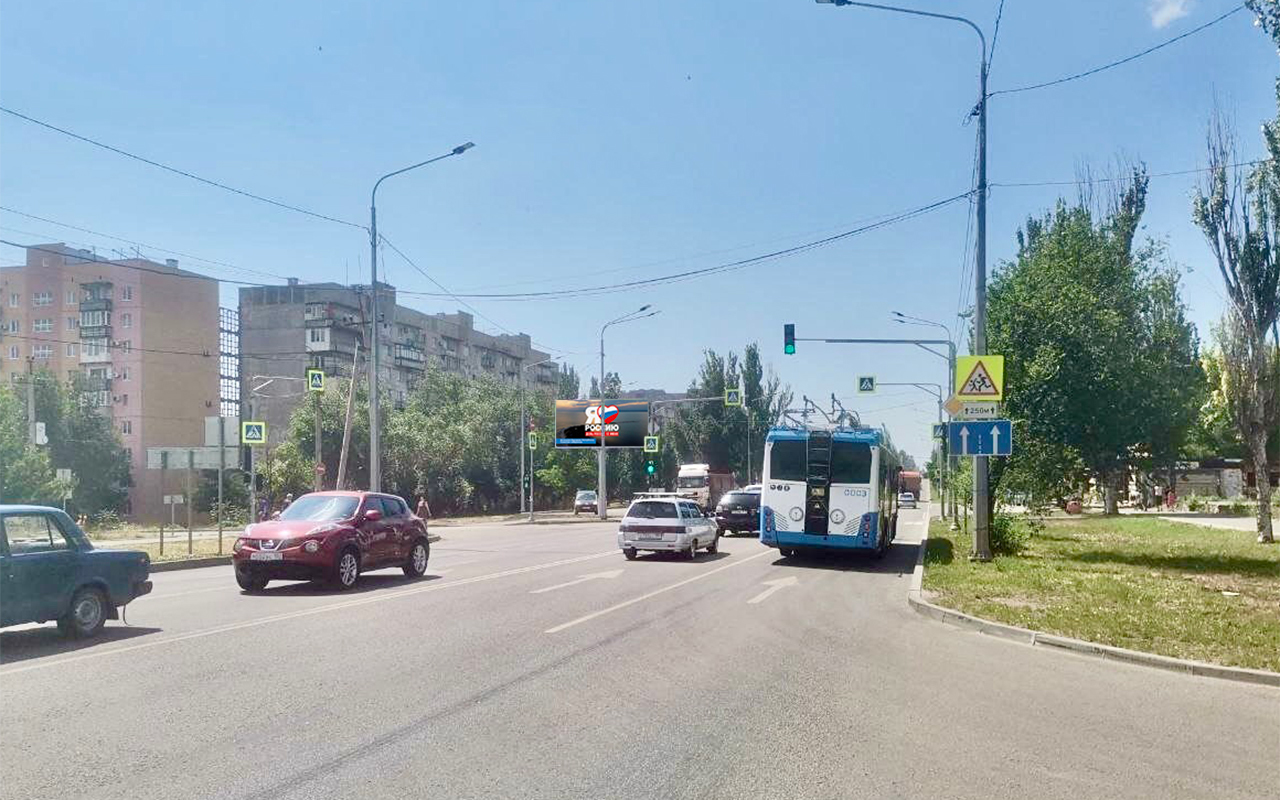 Фотография рекламного носителя, тип: Билборд 3x6, адрес: Строителей пр-т. Х Бахмутская ул., поз.1, Мариуполь, Донецкая область, Россия. Сторона В1-В10 №1097597