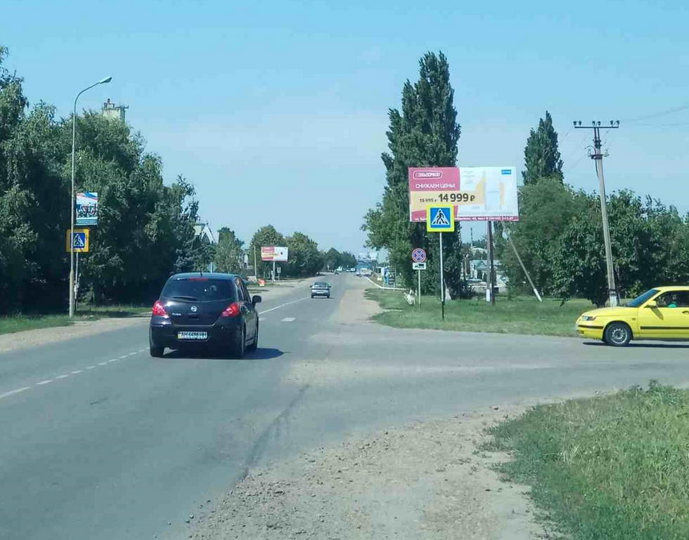 Фотография рекламного носителя, тип: Билборд 3x6, адрес: Брюховецкая ст., О. Кошевого ул. Х Батарейная ул., Краснодарский край, Россия. Сторона А №1020541