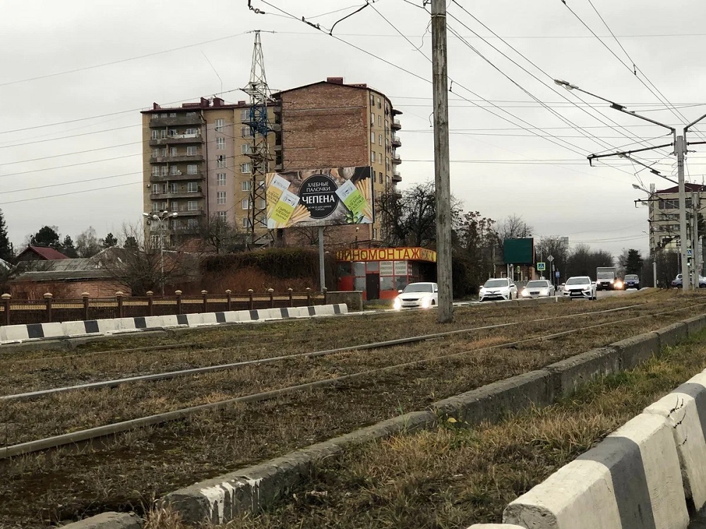 Фотография рекламного носителя, тип: Билборд 3x6, адрес: Чапаева ул., въезд на мост со стороны пр-та Коста, Владикавказ, Республика Северная Осетия – Алания, Россия. Сторона Б №1057345