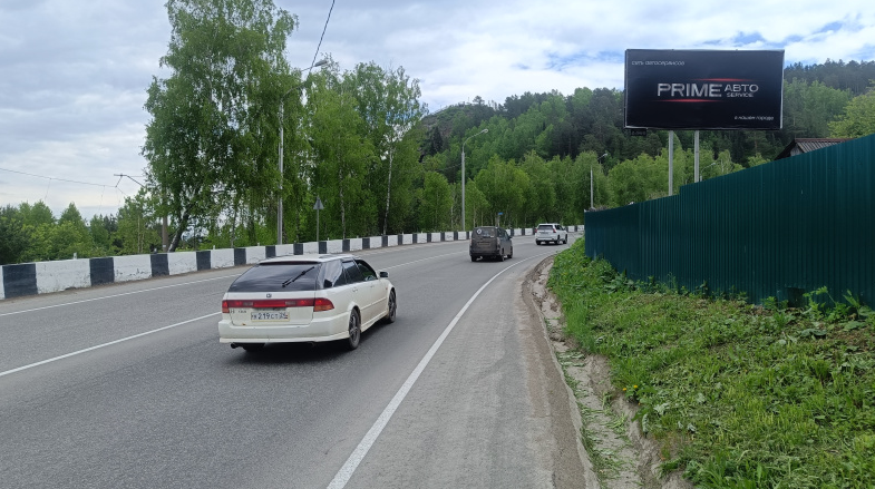 Фотография рекламного носителя, тип: Билборд 3x6, адрес: Слизнево пос., 400м до смотровой площадки, Красноярск, Красноярский край, Россия. Сторона А №780211