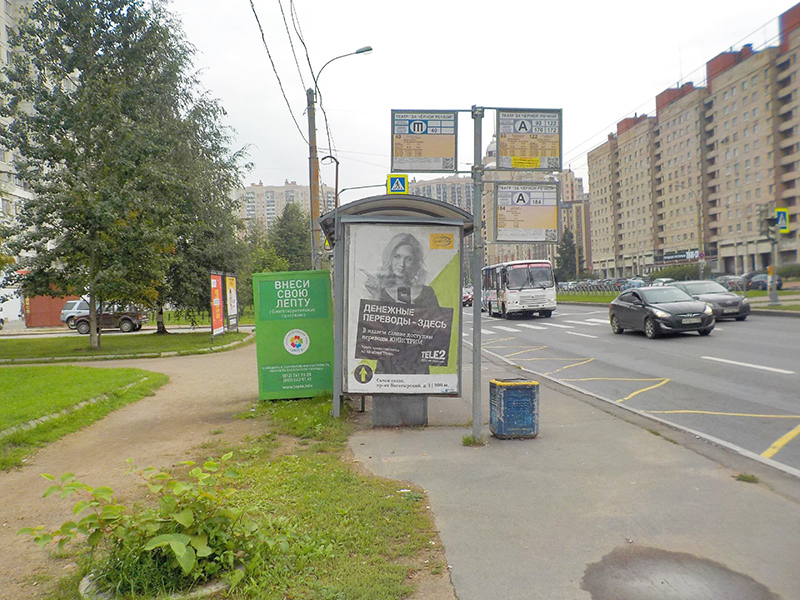 Фотография рекламного носителя, тип: Остановка 1.8x1.2, адрес: Богатырский пр-т., д.7, корп.3, Санкт-Петербург, Россия. Сторона B №1094333