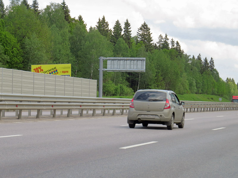 Фотография рекламного носителя, тип: Билборд 3x6, адрес: Новорижское ш., 58 900м, Московская область, Россия. Сторона Б №443841