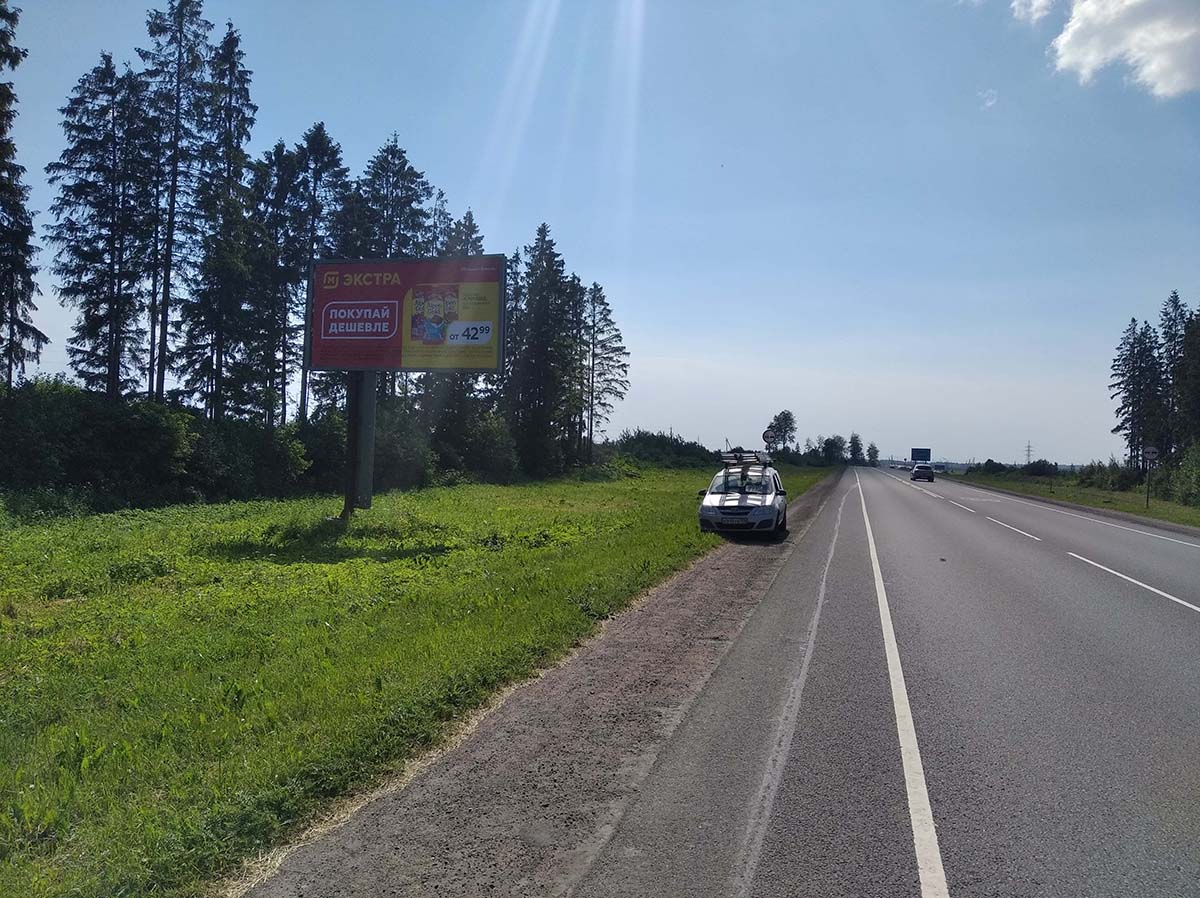 Фотография рекламного носителя, тип: Билборд 3x6, адрес: Таллинское ш., 111 500м, Ополье д., Ленинградская область, Россия. Сторона Б №979134