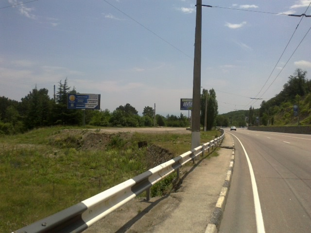 Фотография рекламного носителя, тип: Билборд 3x6, адрес: Южнобережное ш., 34 800м, Алушта, Республика Крым, Россия. Сторона B №411395