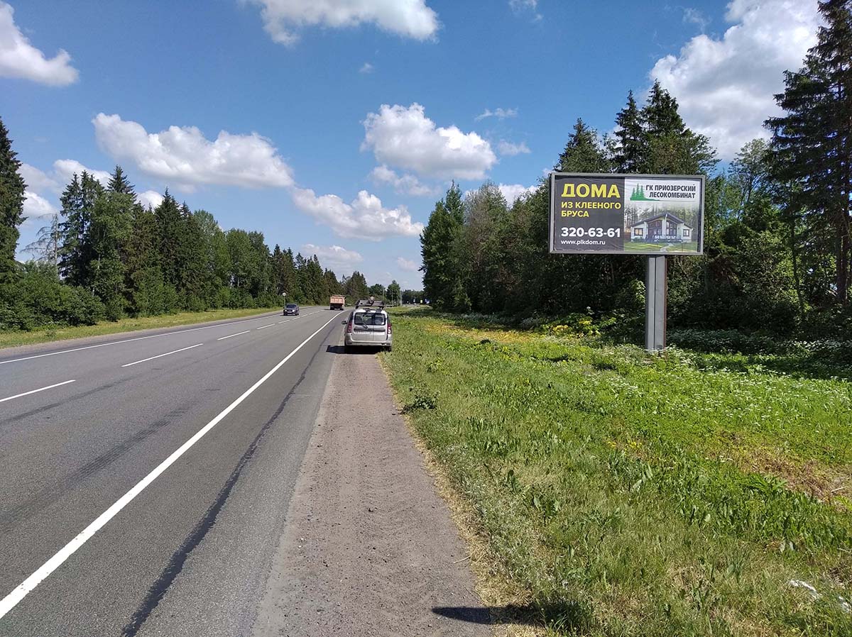 Фотография рекламного носителя, тип: Билборд 3x6, адрес: Таллинское ш., 111 500м, Ополье д., Ленинградская область, Россия. Сторона A №979133