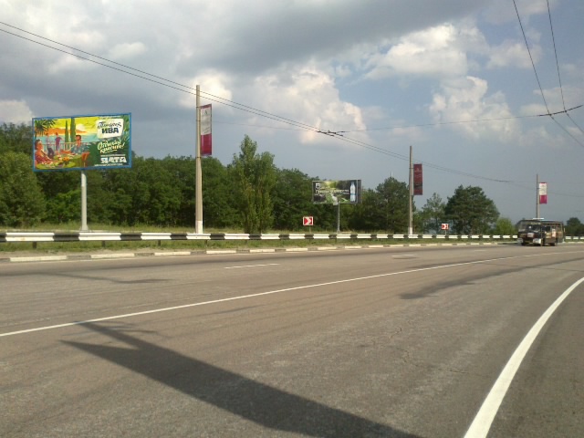 Фотография рекламного носителя, тип: Билборд 3x6, адрес: Южнобережное ш., 34 500м, Алушта, Республика Крым, Россия. Сторона B №411393