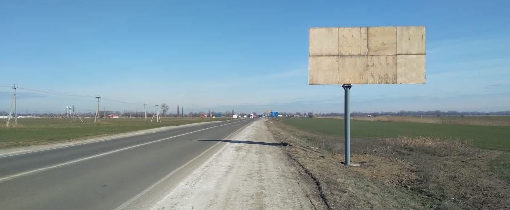 Фотография рекламного носителя, тип: Билборд 3x6, адрес: Краснодар-Темрюк а/д, 65 630м, слева, Славянск-на-Кубани, Краснодарский край, Россия. Сторона A №872463