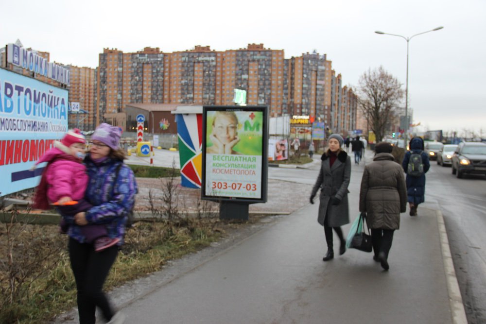 Фотография рекламного носителя, тип: Ситиформат 1.8x1.2, адрес: Ленинградская ул., за ж/д переездом, поз.2, Кудрово, Ленинградская область, Россия. Сторона B №717334