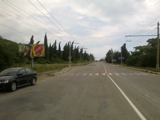 Фотография рекламного носителя, тип: Билборд 3x6, адрес: Южнобережное ш., 58 500м, Алушта, Республика Крым, Россия. Сторона B №411401