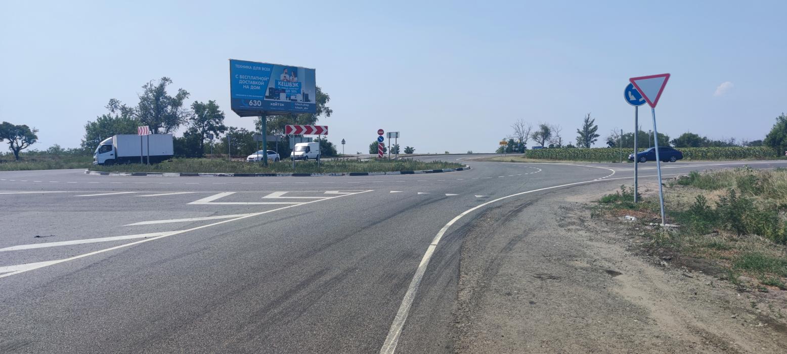 Фотография рекламного носителя, тип: Билборд 3x6, адрес: Кольцо на выезде в сторону Мариуполя, Володарское, Донецкая область, Россия. Сторона А1 №1326778