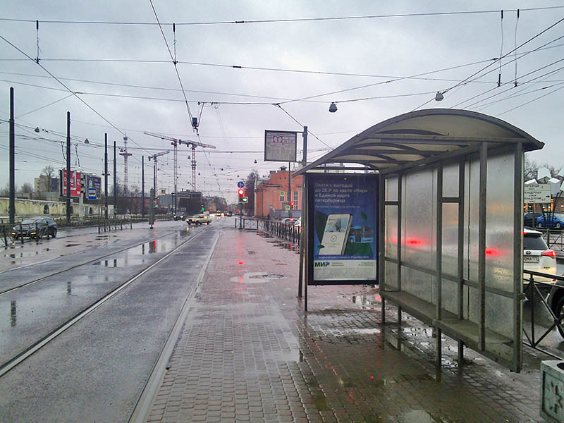 Фотография рекламного носителя, тип: Остановка 1.8x1.2, адрес: Лесной пр-т. X Смолячкова ул., д.21, Санкт-Петербург, Россия. Сторона А №164387