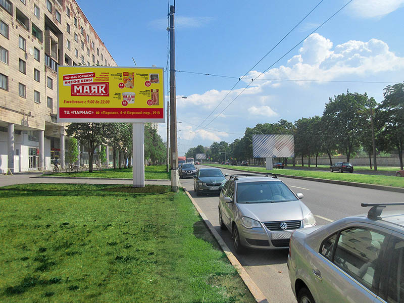 Фотография рекламного носителя, тип: Билборд 3x6, адрес: Непокоренных пр-т., д.4, Санкт-Петербург, Россия. Сторона В №164669