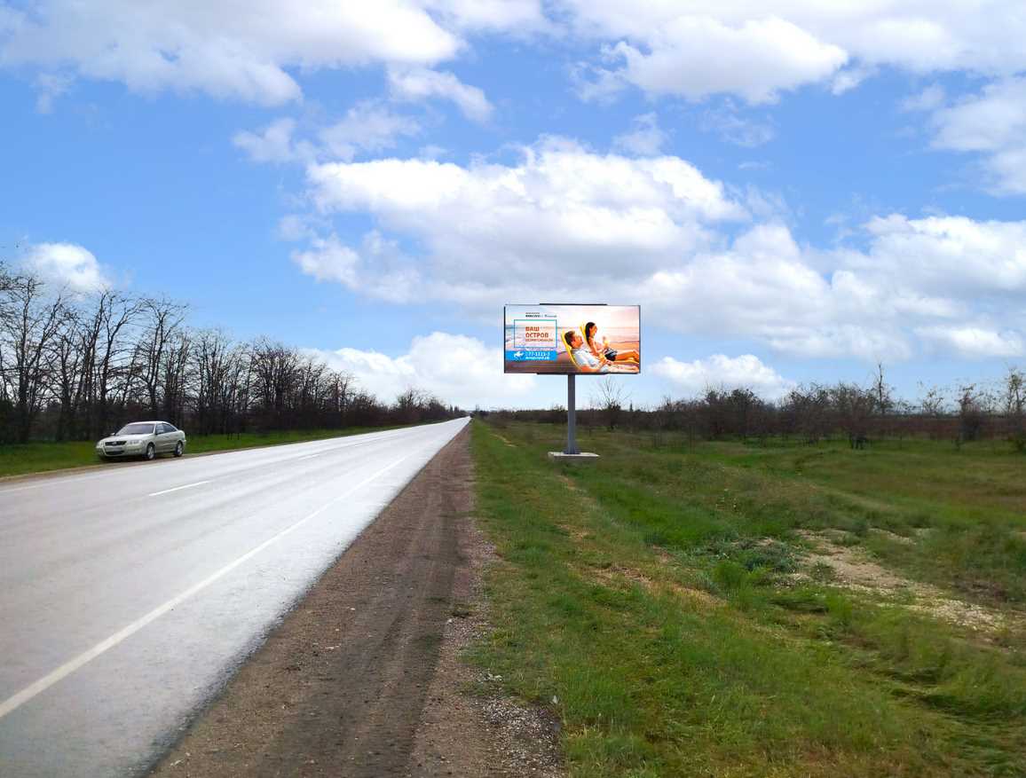 Фотография рекламного носителя, тип: Билборд 3x6, адрес: Кировское - Первомайское 9 453м, перед поворотом на Новопокровку, Кировское, Донецкая область, Россия. Сторона A №1377031
