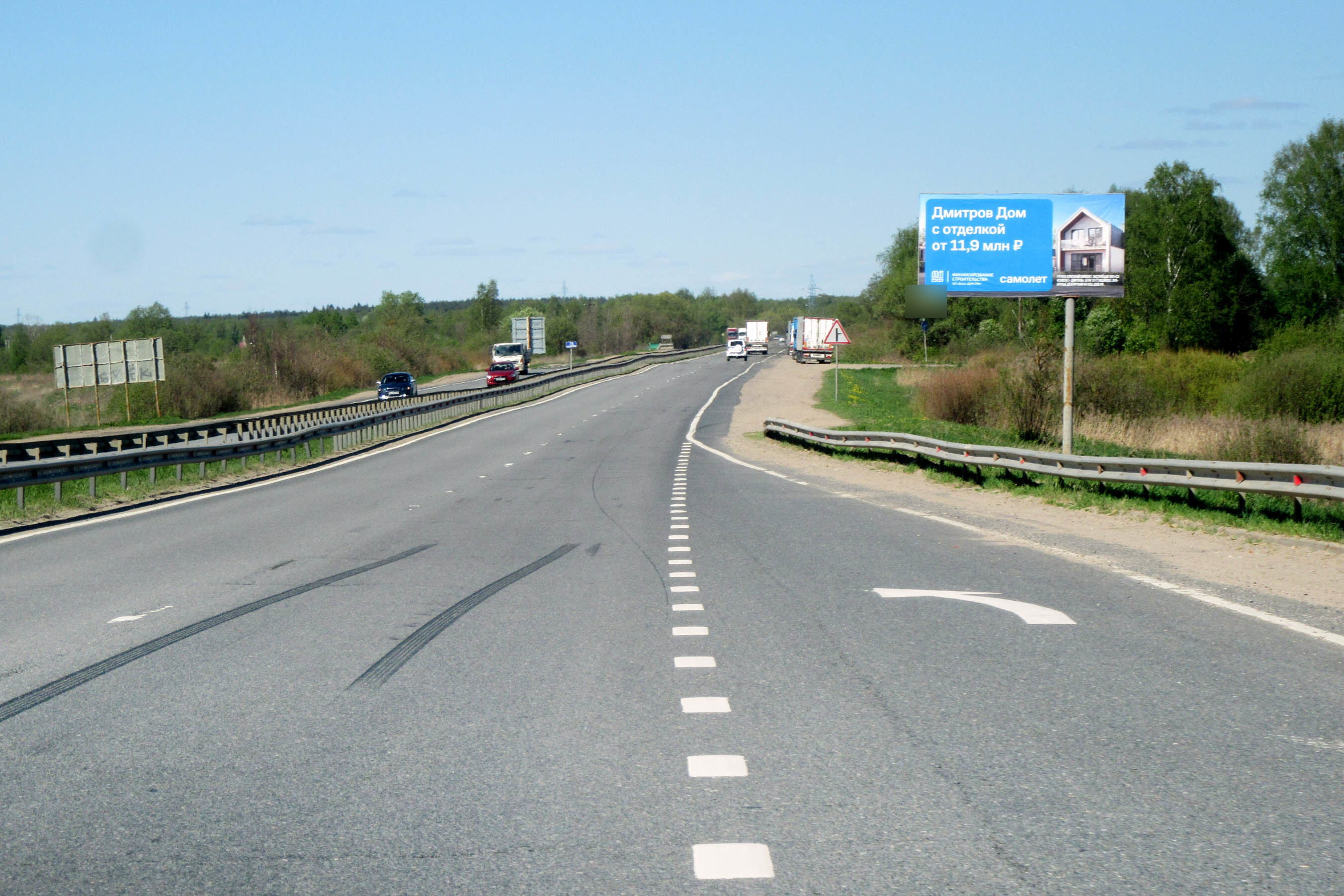 Фотография рекламного носителя, тип: Билборд 3x6, адрес: Дмитровское ш., 75 700м, Московская область, Россия. Сторона А №1045282