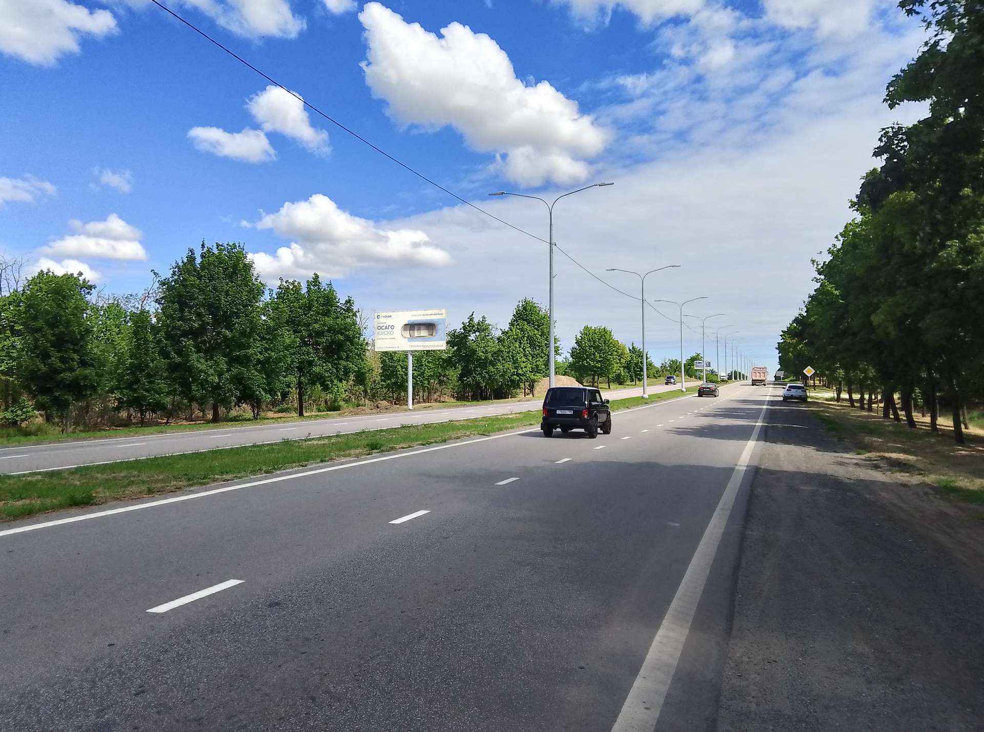 Фотография рекламного носителя, тип: Билборд 3x6, адрес: Донецкое шоссе, въезд в Мариуполь, 500м до ул. Новосибирская, Мариуполь, Донецкая область, Россия. Сторона Б №1372501