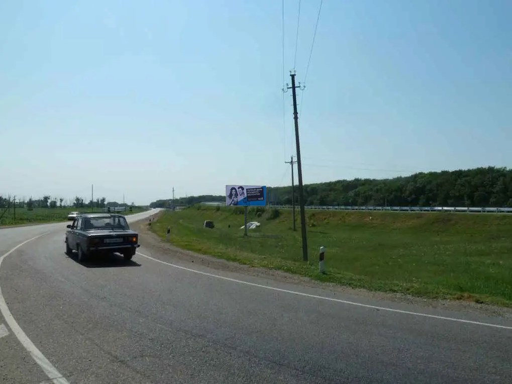 Фотография рекламного носителя, тип: Билборд 3x6, адрес: "Азов-Александровка-Старом-я" а/д, 88 380м, Краснодарский край, Россия. Сторона А №714608