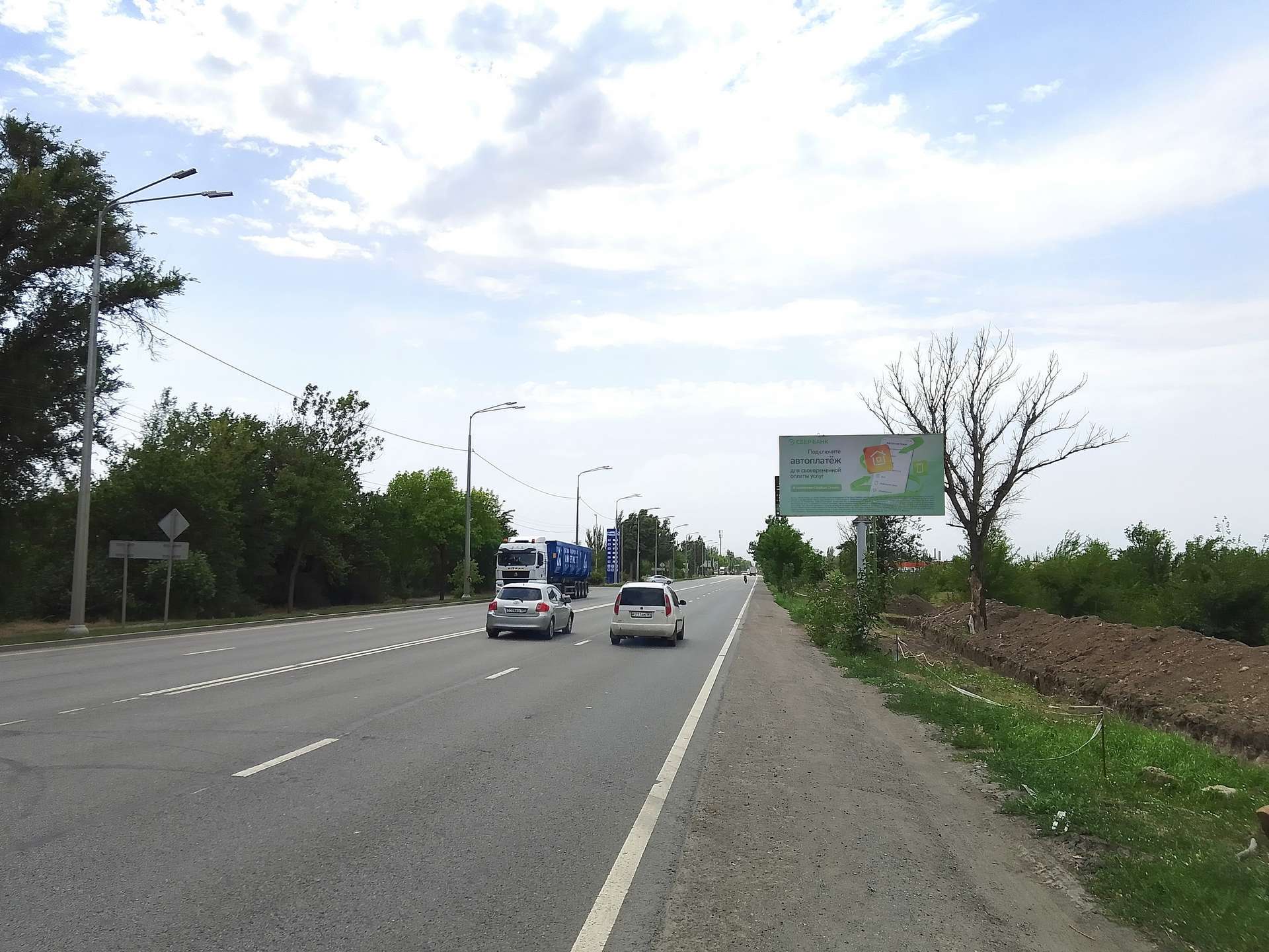 Фотография рекламного носителя, тип: Билборд 3x6, адрес: Таганрогская ул. X Орджоникидзе ул., Мариуполь, Донецкая область, Россия. Сторона A №1372571