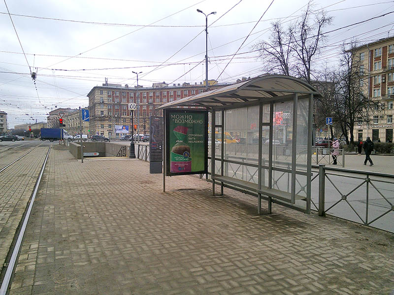 Фотография рекламного носителя, тип: Остановка 1.8x1.2, адрес: Новочеркасский пр-т., д.41 Х Заневская пл., Санкт-Петербург, Россия. Сторона А №165010