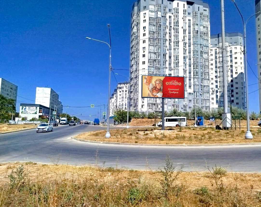 Фотография рекламного носителя, тип: Билборд 3x6, адрес: Александра Маринеско ул., д.6, Евпатория, Республика Крым, Россия. Сторона A №1377048