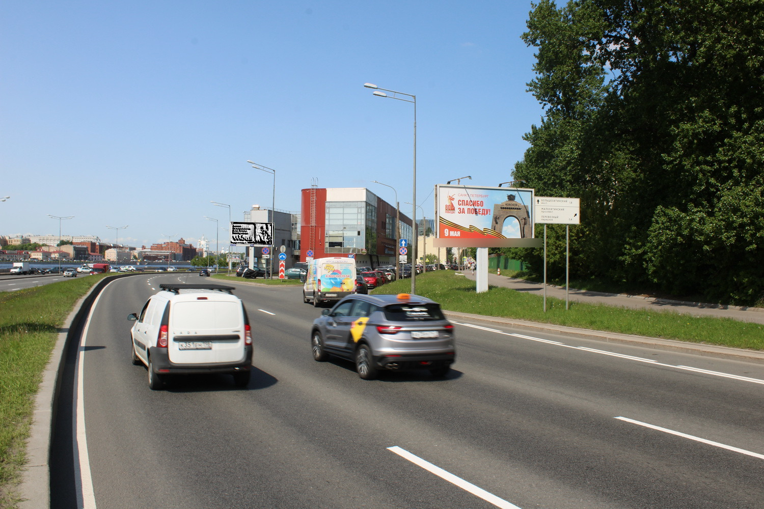 Фотография рекламного носителя, тип: Билборд 3x6, адрес: Малоохтинский пр-т., д.80 Х Малоохтинская наб., Санкт-Петербург, Россия. Сторона А №673236